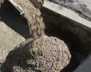 Flowable fill or block fill concrete pouring into construction hole